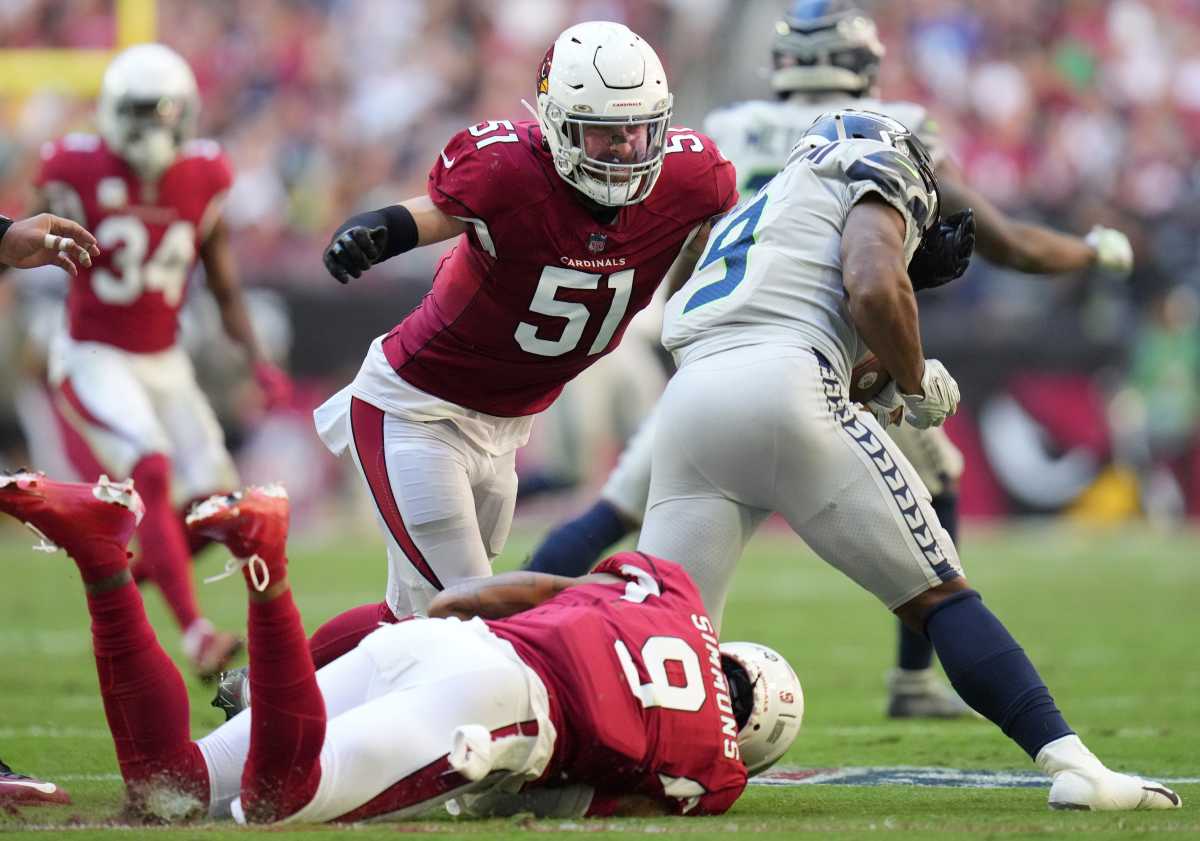 Nov 6, 2022; Phoenix, AZ, United States; Arizona Cardinals linebackers Tanner Vallejo (51) and Isaiah Simmons (9) tackle Seattle Seahawks running back Kenneth Walker III (9) at State Farm Stadium. 